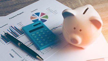 Piggy bank and calculator