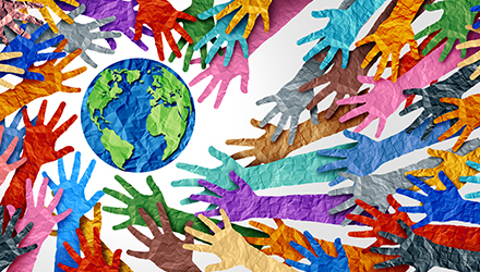 Multicolored hands around globe