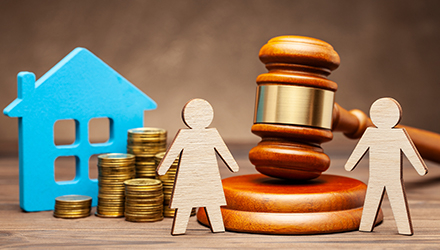 Gavel with home and paper family cut-outs