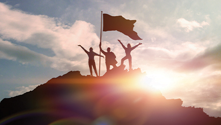 Flag & People on top of Mountain