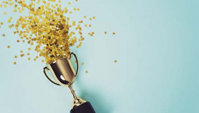 trophy with confetti