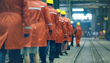 Uniformed factory workers