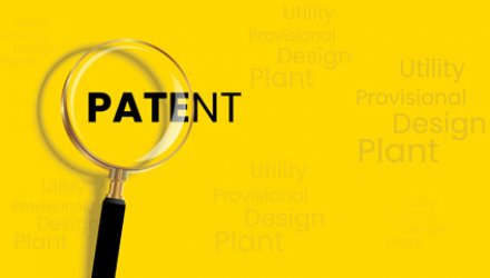 Magnifying Glass looking at the word Patent