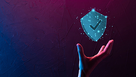 hand by computer security badge