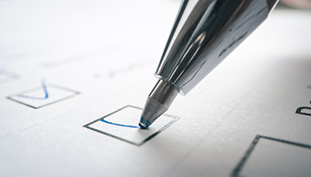 pen checking a box