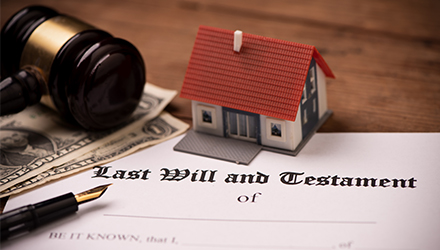 Gavel, one-dollar bills, pen, figurine home and last will and testament