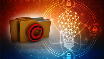 A Graphic of Folders with the Copyright Symbol and a Glowing Lightbulb in the Background
