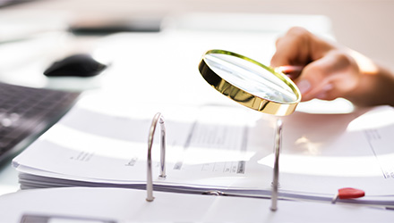 Magnifying glass and documents
