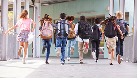 Children at school with backpacks
