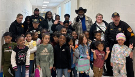 Fox Team with local police team and local children for holiday donation