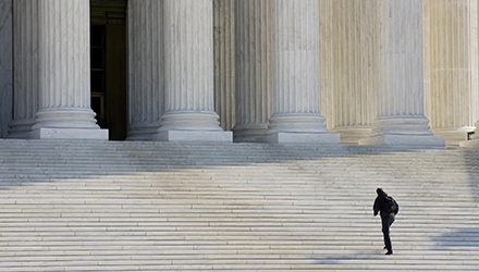 A person ascending the US Supreme Court steps